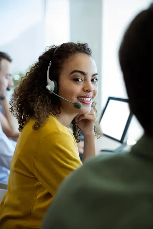 JFW customer service agent helping a customer on the phone.
